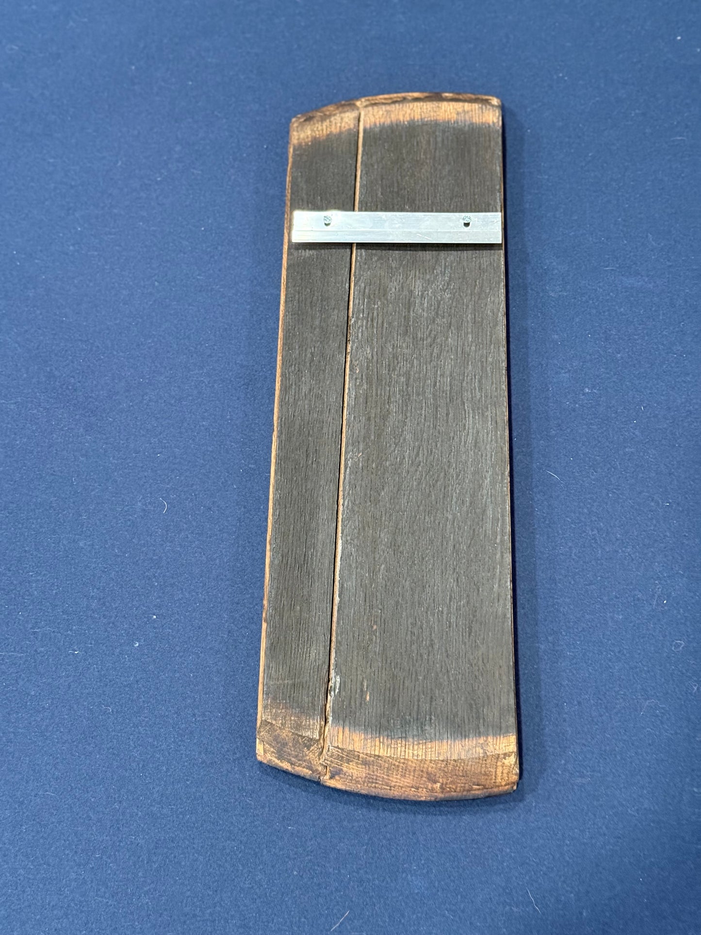 reverse side of 1/4 barrel lid with french cleat attached for hanging