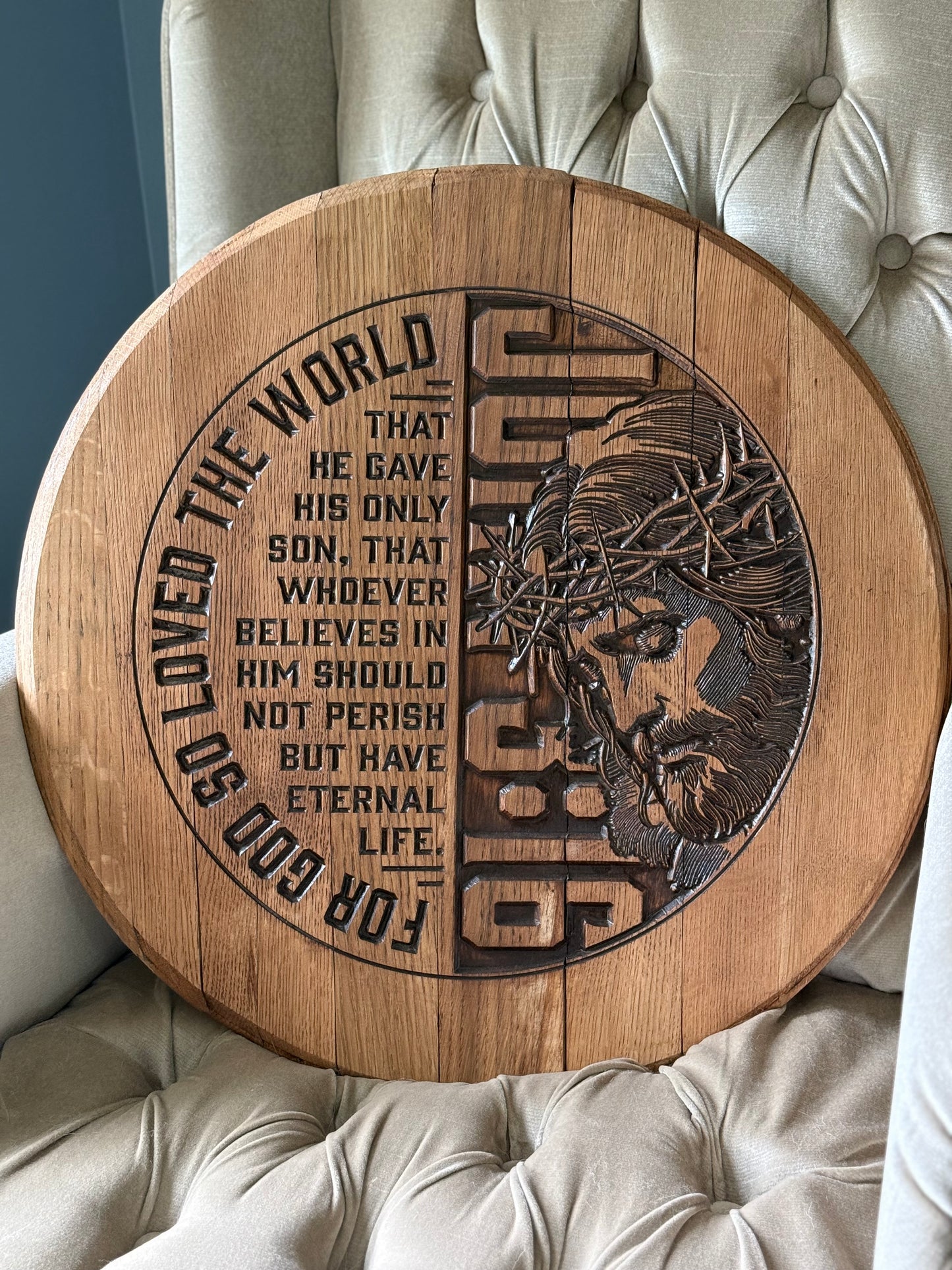 Bible verse "For God so loved the world..." on left half of bourbon barrel head and Christ with crown of thorns with "John 3:16" in background vertically on right half.