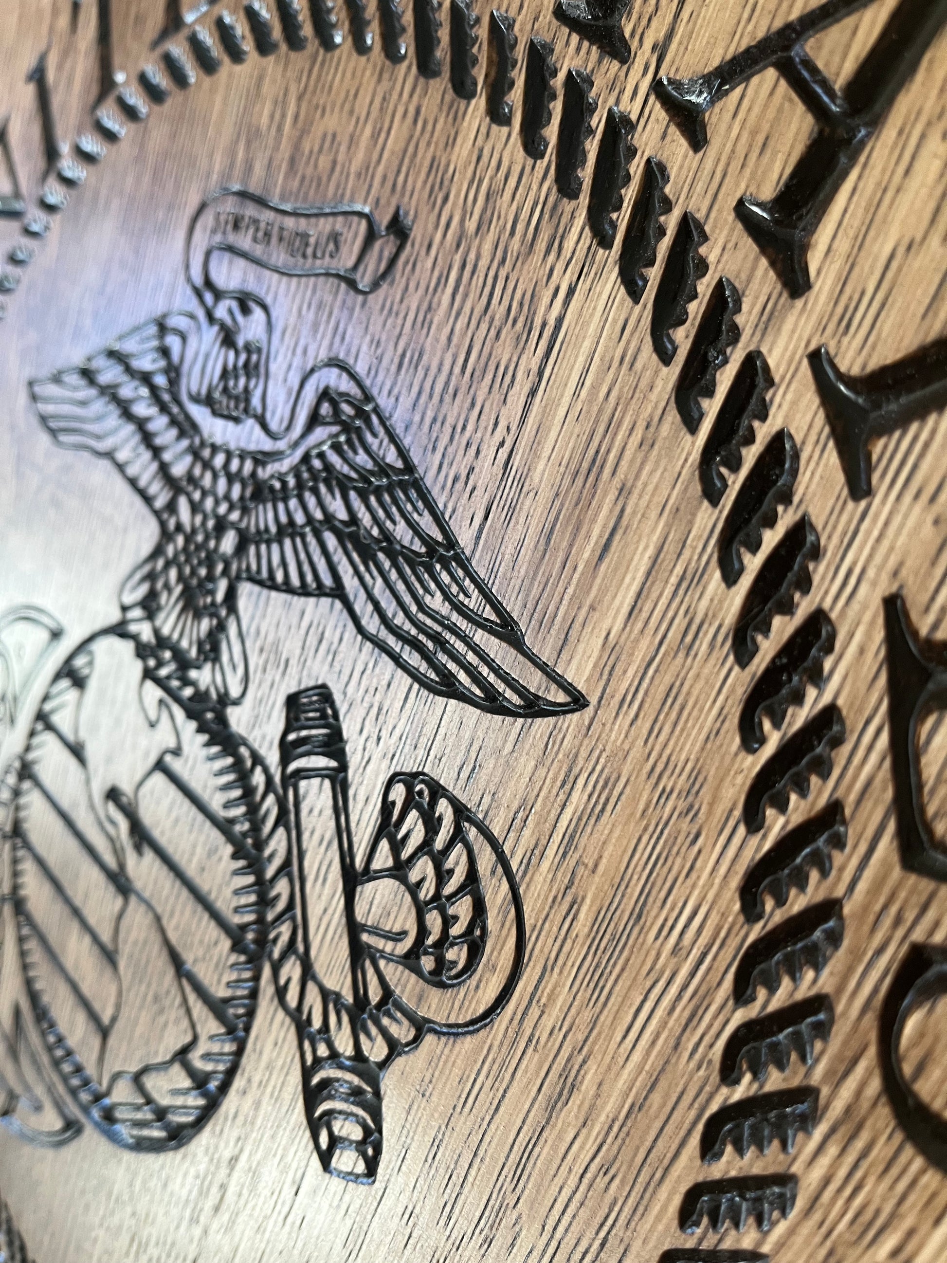 closer image of Bourbon Barrel lid with "United States" upper rocker, "Marine Corps" lower rocker, and the Corps emblem in center